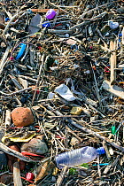 Plastic rubbish discarded at sea washed up on hightide drift line, Merseyside, UK 2012