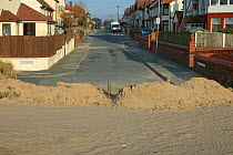 Sand blown into town from destroyed sand dune, illustrating poor land management decisions (relocation of sand dune) Merseyside, UK 2012