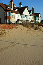 Sand from translocated sand dune blown into roads and homes causing extensive problems to community, caused by non stabilisation of translocated sand dune, problems of poorly executed coastal engineer...