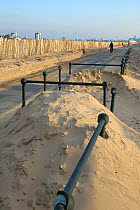 Sand blown around public paths following poorly executed coastal sand dune project, Crosby, Merseyside, UK 2012