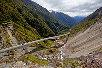 The Otira Viaduct passing through stunnng mountain scenery in the Southern Alps of New Zealand, Otira Gorge, West Coast, New Zealand, November 2010.