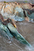 Layers of sedimentary rocks (sandstone, mudstone, dolomite, limestone) on beach, Vardo, Varanger-Peninsula, Finnmark, Norway, July 2006