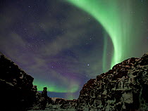 Northern lights over the canyon in the Thingvellir National Park, UNESCO World Heritage Site, Iceland, March 2011