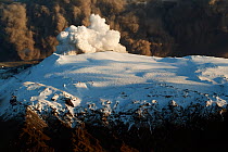 Subglacial volcanic eruption under the Eyjafjallajokull ice cap with ash plume from the volcano above, Iceland, April 2010