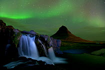 Small waterfall near Mount Kirkjufell with aurora borealis in the night sky, Snaefellsnes, Iceland, September 2010