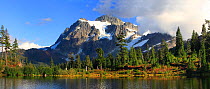 Mt. Shuksan and the forest of Douglas firs on the shore of Picture Lake, North Cascades National Park  Mt. Baker Recreatation Area, Washington, USA, January 2000. Stiched panorama.