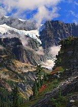 View of Mt. Shuksan (9127 ft) with snow and clouds, North Cascades National Park, Mt. Baker Recreation Area, Cascades Range, Washington, USA, October 2009.