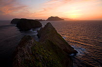 Sunset over Middle and West Anacapa Islands and Santa Cruz Island, view from Inspiration Point on East Anacapa Island, Channel Islands National Park, California, USA, April 2011.