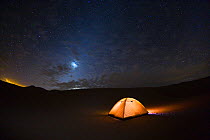 Camping under the starry sky in the Libyan desert, Libya, North Africa, December 2007