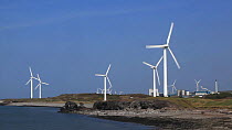 Wind turbines turning at Oldside and Siddick windfarm on the Solway Firth, Cumbria, England, UK, April
