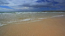 Gentle waves breaking on sandy beach, North Uist, Outer Hebrides, Scotland, UK, May