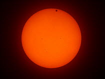 The transit of Venus across the face of the sun, with visible sunspots, as seen from Aurora, Colorado, USA, 16.33 local time, 5 June 2012.