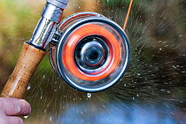 Water spray from a spinning fishing reel, River Tweed, Berwickshire, Scotland, UK, January 2012. 2020VISION Exhibition. 2020VISION Book Plate. Did you know? The earliest record of use of fishing reels...