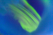 Northern lights / Aurora borealis patterns partially obscured by clouds, Southern Iceland, Iceland, Europe, March 2012