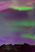 Northern lights / Aurora borealis over mountains, Southern Iceland, Iceland, Europe, March 2012