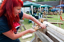 Visitor using a lathe whilst attending the Black Country Living Landscapes Wildlife Roadshow, Sandwell Park Farm, West Bromwich, West Midlands, England, UK, August 2011. Model released. 2020VISION Boo...