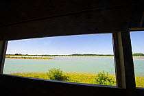 View through hide window out on to recently completed and filled lagoon at Rutland Water. UK June 2010.