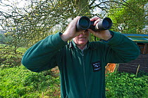 Volunteer monitoring and guarding osprey nest at Rutland Water. UK, May.
