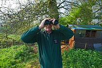Volunteer monitoring and guarding osprey nest at Rutland Water. UK, May.