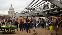 Timelapse of people watching peregrines through telescopes at the RSPB Peregrine falcon event, Tate Modern, South Bank, London, England, UK, September 2011.