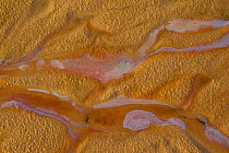 Oil on surface of water on sandy beach. Sandyhills Bay, Solway Firth, Dumfries and Galloway, Scotland, UK, February 2012.