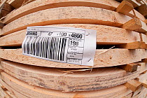 Batch of sawn and processed timber with descriptive label, stacked in BSW sawmill, Boat of Garten, Inverness-shire, Scotland, UK, February 2012.