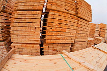 Sawn and processed timber stacked in BSW sawmill, Boat of Garten, Inverness-shire, Scotland, UK, February 2012.
