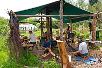 Volunteers working on wood at the Birmingham EcoPark, a Black Country Living Wildlife Trust education centre in Small Heath, West Midlands, July 2011. Model released.