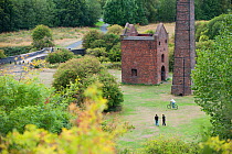People walking anc cycling by disused industrial buildings near Bumble Hole Nature Reserve, Sandwell, West Midlands, July 2011