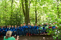 Children from Rowley View Nursery School exploring nature at the Moorcroft Environmental Centre Forest School, Moorcroft Wood, Moxley, Walsall, West Midlands, July 2011. Model released.