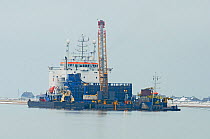 Barge laying cables for the London Array wind farm, Swale, Kent, England, UK, July.