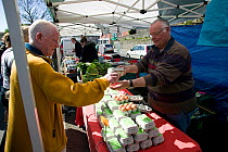 Organic eggs being sold in Oystermouth food market; selling fresh and specialist farm produce to the public. Part of Swansea City Council's commitment to Agenda 21, Swansea, April 2009.