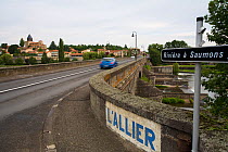 Old stone bridge crossing the river Allier, Pont-du-Chateau, Auvergne, France, August 2010