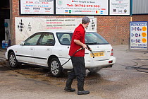 Award winning car washing business using recycled water involving reedbed to aid conservation of precious resource, Swansea, Wales, UK 2009
