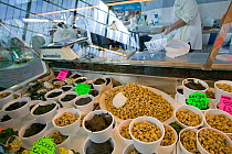 Sustainable marine sea foods, Laverbread (seaweed) and cockles for sale in community market, Swansea, Wales, UK 2009
