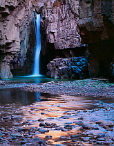 Cibecue Creek waterfall pouring through canyon narrows, White Mountain Apache Reservation, Arizona, USA
