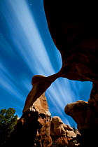 Metate Arch, Grand Staircase-Escalante National Monument with moonlight illuminating the arch under stary sky, Great Basin Desert, Utah, USA