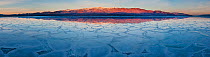 Crystalized salt formation across the Death Valley National Park valley floor with morning light on Badwater, the lowest point in the US at 86m below sea level with Telescope Peak in the Panamint Moun...