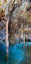 Stalagmites and stalactites with turquoise waters of Cenote Papakal, near Merida, Yucatan, Mexico
