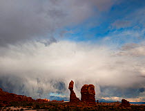 Storm clouds over Balanced Rock, Arches National Park in sunset light, Utah, USA
