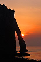 Silhouette of the Porte D'Aval, a natural arch in the chalk cliffs at Etretat, Côte d'Albâtre, Upper Normandy, France, March