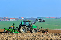 Tractor sowing seeds with seed drill machine, Cap Gris Nez, Côte d'Opale / Opal Coast, France March