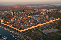 Aerial view of the walled city of Aigues-Mortes with the Charnier marshes in the background, Camargue, Southern France, November 2008