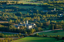 Aerial view of the Convent Ste Scolastique and the Abbaye St-Benoit near Dourgne at the foot of the Montagne Noire, in the rolling Lauragais countryside, Tarn, Midi-Pyrenees, France. September 2011.