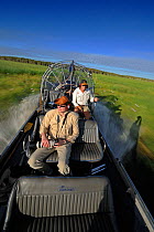 Tourist air boat safari in Bamarru Plains, North West Territories, Australia, May 2009
