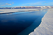 Crack in the pack ice, Manson Icefield peninsula and Jakeman glacier, Ellesmere Island, Nunavut, Canada, June 2012