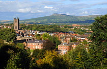 View over Ludlow with St. Laurence church and Titterstone Clee Hill in background, Shropshire, England, UK, August 2011