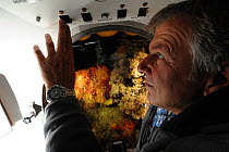 Jurgen Schauer pilot of the submersible JAGO on a dive with corals visible through the viewport. Atlantic ocean, Norway, September 2011, editorial use only. Photo taken in cooperation with GEOMAR cold...
