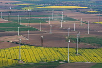 Aerial view of wind turbines in flowering rape fields. Lower Saxony, Germany, April 2012.