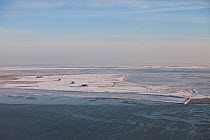 Aerial view over Hallig Nordstrandischmoor. Wadden Sea National Park, Schleswig-Holstein, Germany, February 2012.